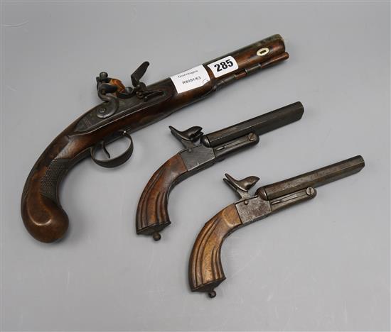 An Edwards flintlock pistol and two replicas